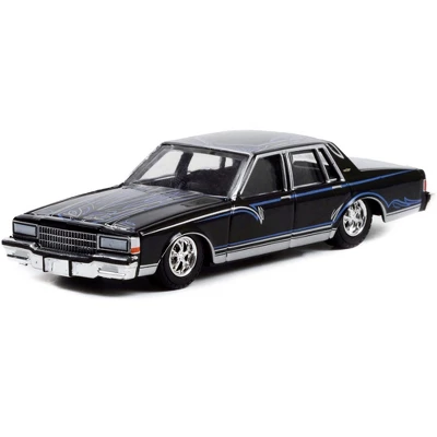 1987 Chevrolet Caprice Lowrider Custom Black With Graphics "California Lowriders" Release 1 1/64 Diecast Model Car By Greenlight 3 1987 Chevrolet Caprice Lowrider Custom Black With Graphics "California Lowriders" Release 1 1/64 Diecast Model Car By Greenlight